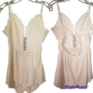 - White lace trimmed romper with back cut out